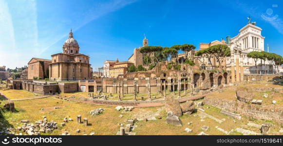 Ancient ruins of Forum and Victor Emmanuel II monument in a summer day in Rome, Italy
