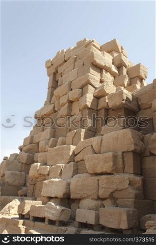 Ancient ruins of Karnak Temple against blue sky in Luxor, Egypt