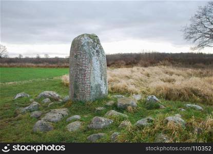 Ancient runestone by Karlevi at the swedish island Oland