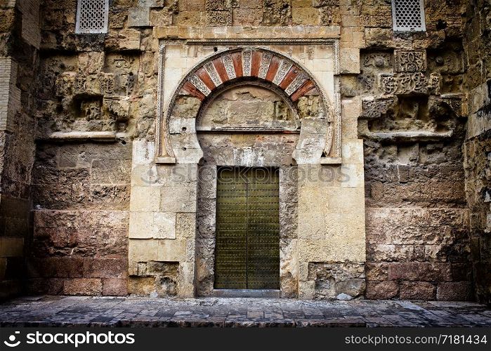 Ancient side door to the Mezquita (The Great Mosque) in Cordoba, Andalusia, Spain.