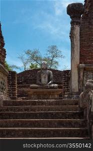Ancient sitting Buddha image in votadage. Pollonaruwa, Sri Lanka