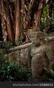 Ancient statue in the forest