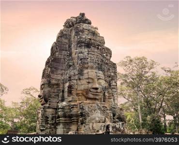 Ancient stone faces of Bayon temple in Angkor Thom, Siemreap, Cambodia.