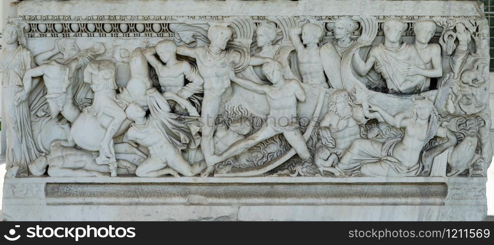 Ancient stone sarcophagus with battle scenes at the entrance of the Archaeological Museum of Thessaloniki Soldiers in battle Scene from foot of sarcophagus ancient macedonia greece