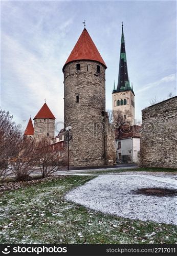 Ancient stone walls of Tallinn with four towers in alignment taken in HDR to get extra clarity