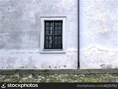 Ancient street. Old building, old style window, wall and rain-pipe