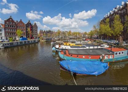 Ancient streets and canals in the city center of Amsterdam. Netherlands.