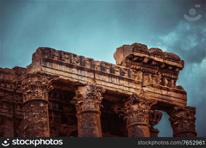 Ancient Temple Ruins of Lebanon. Vintage Style Photo of Baalbek. Majestic Old Columns over Cloudy Sky Background.