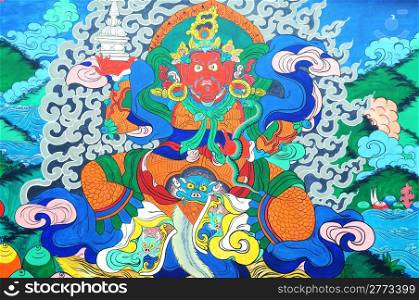 Ancient Tibetan wall painting art of buddha in a historic Tibetan lamasery