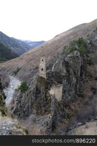 Ancient Towers of Ingushetia and river between the mountains. Antic architecture and ruins of Northern Caucasus, Russian Federation