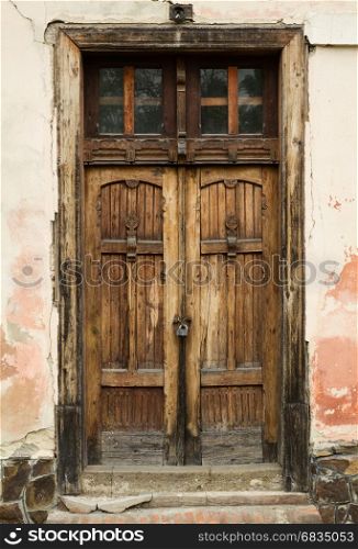 Ancient wooden door on the building