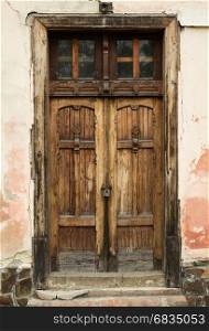 Ancient wooden door on the building