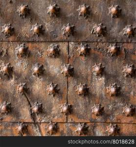 Ancient wooden spiked door detail in Genoa, Italy