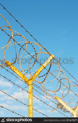 and cloudy sky in oman barbwire in the background