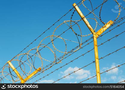 and cloudy sky in oman barbwire in the background