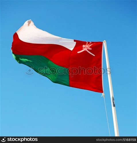 and the cloudy sky in oman waving flag