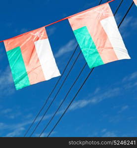 and the cloudy sky in oman waving flag