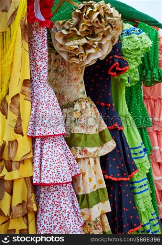 Andalusian gipsy dresses in a row at Spain outdoor market
