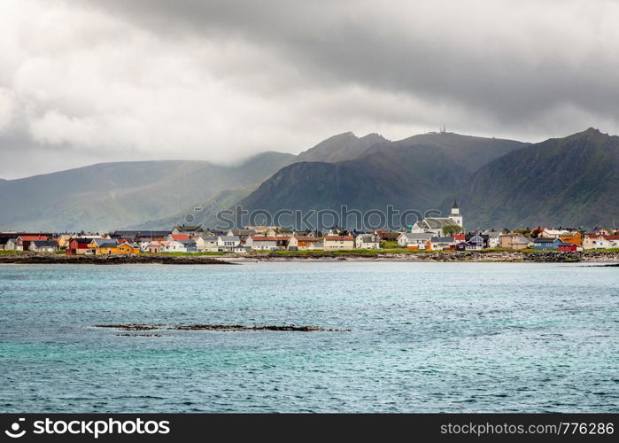 Andenes village panorama with multiple houses and mountains in the background, Lofoten islands, Andoy Municipality, Vesteralen district, Nordland county, Norway