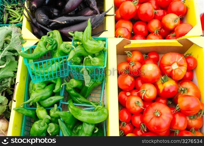 Anehiem chilies, heirloom tomatoes and eggplant for sale at the market. Chilies And Tomatoes