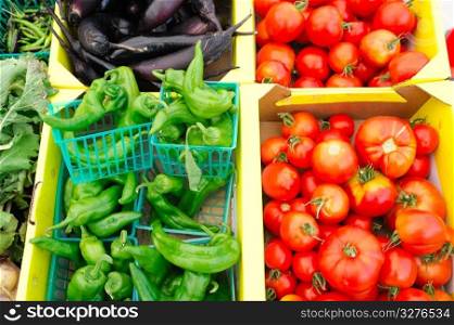 Anehiem chilies, heirloom tomatoes and eggplant for sale at the market. Chilies And Tomatoes