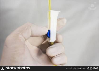 Anesthesiologist Doctors is adjusting extension tube control of saline solution mixed drug,Corona virus treatment concept,Covid-19.