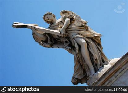 Angel holding cross on the Bridge of San Angelo, Vatican City, Rome, Italy