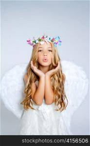 Angel little girl blowing expression with wings and flowers crown