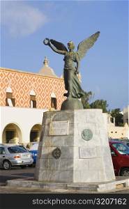 Angel statue in front of a building, Rhodes, Dodecanese Islands, Greece