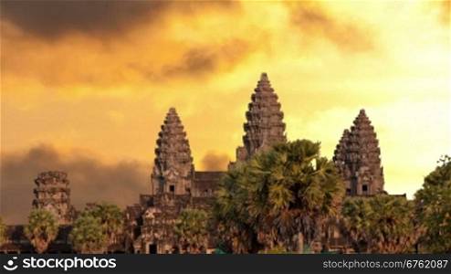 Angkor Wat temple silhouette with sunset sky and clouds
