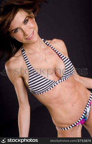 Angled Portrait Petite Woman Black Background Swimsuit Bikini