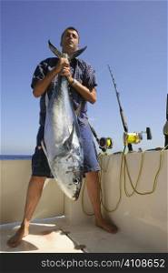Angler fihing big game bluefin tuna on Mediterranean saltwater