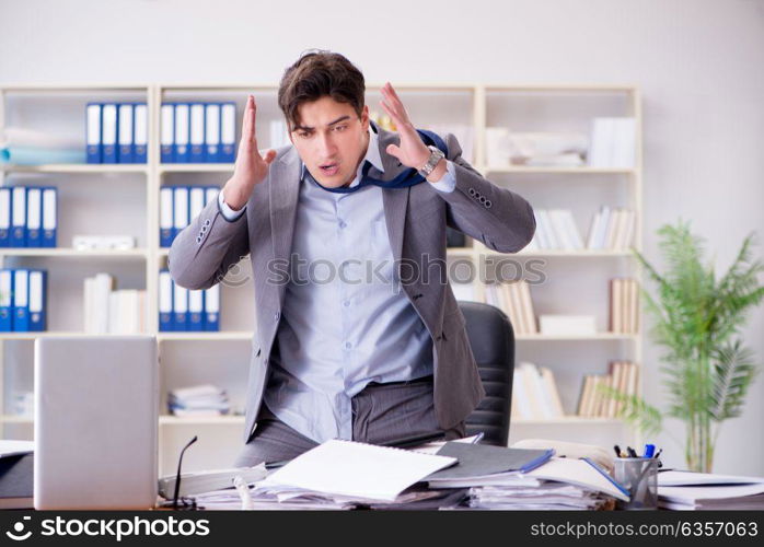 Angry aggressive businessman in the office