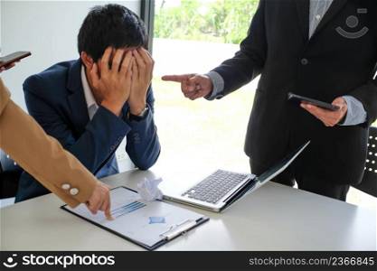 Angry boss Bullying with an out of control boss shouting to a stressed employee. Anger issues and stress office bullies