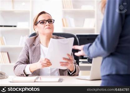 Angry boss dismissing employee for bad underperformance