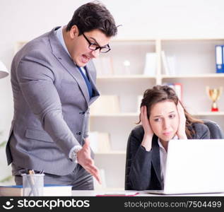 Angry boss unhappy with female employee performance. The angry boss unhappy with female employee performance