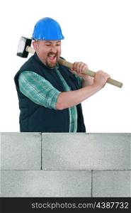 Angry builder about to smash wall