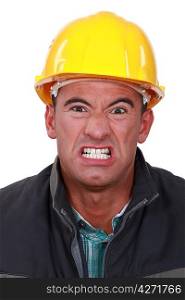 Angry builder grimacing