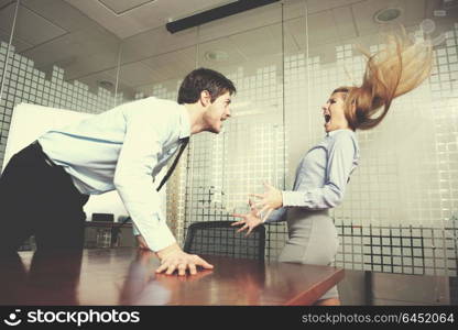 Angry business man screaming at employee in the office