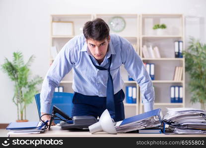 Angry businessman frustrated with too much work