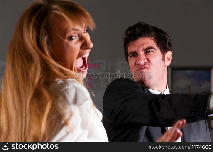 angry businessman is slapping across the businesswoman&acute;s face
