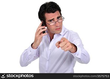Angry businessman pointing at the camera