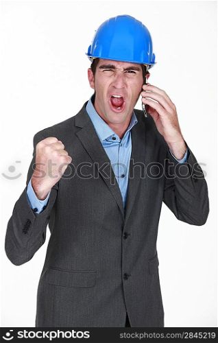angry businessman shouting on his cell
