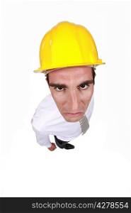 angry businessman wearing a helmet