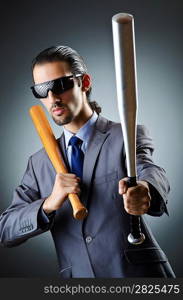 Angry businessman with bat on white