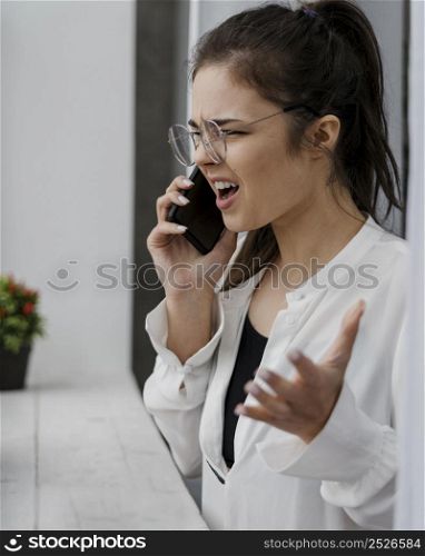 angry businesswoman having bad call