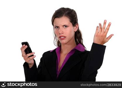 angry businesswoman holding a cell