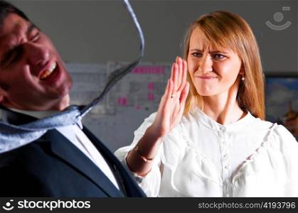angry businesswoman is slapping across the businessman&acute;s face