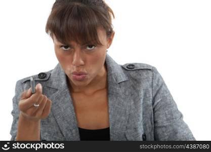 Angry businesswoman pointing with pen