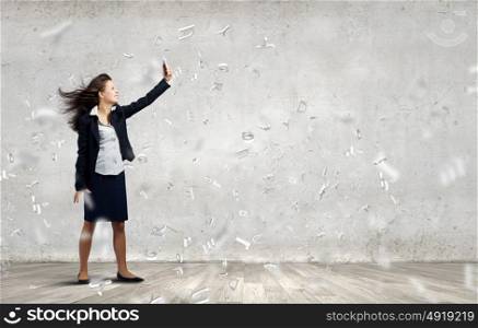 Angry businesswoman. Young businesswoman screaming with rage in mobile phone